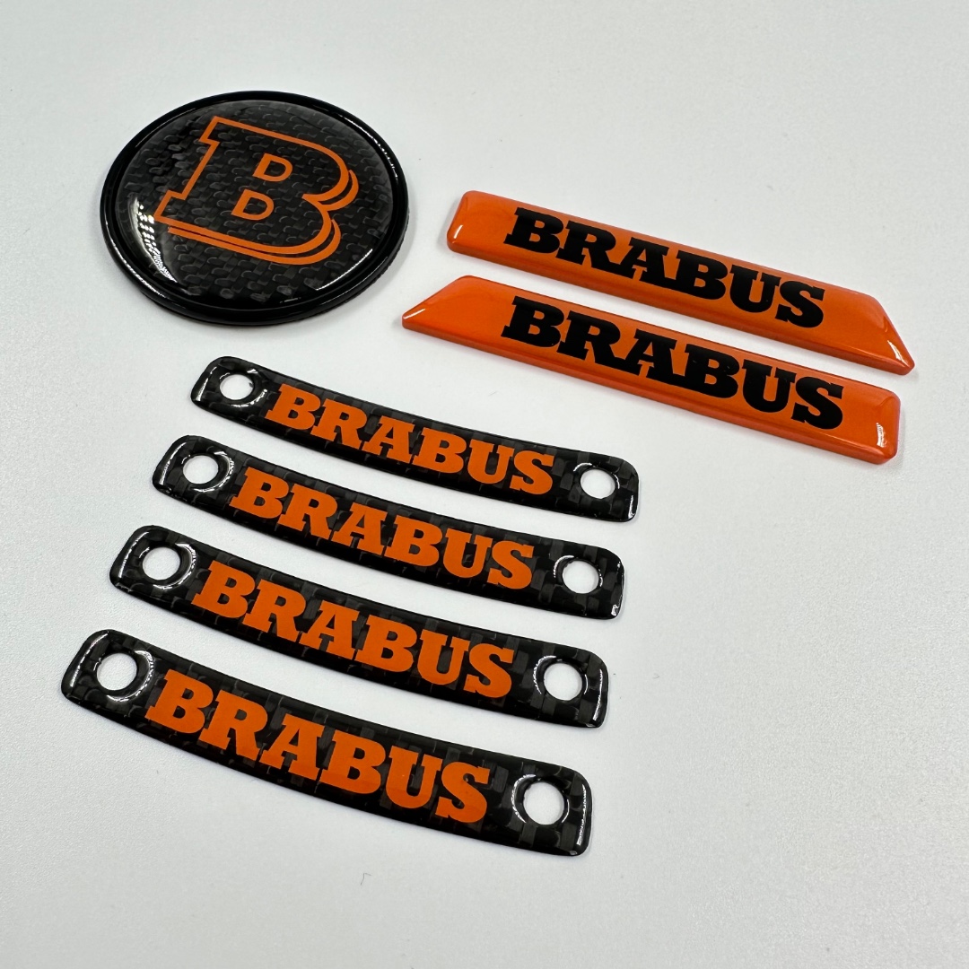 https://kubaydesign.com/assets/images/products/1644/brabus-orange-badge-logo-emblem-set-for-mercedes-benz-w463a-w464-g.jpg