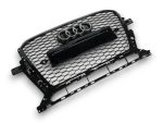 angled shot showing uninstalled RS style chrome frame radiator grille with emblem rings, license plate holder, and black honeycomb mesh