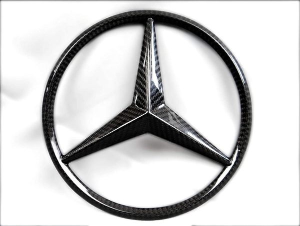 Kubay Design genuine carbon fiber front grille star emblem for Mercedes-Benz G-Class W463, gloss UV-coated finish, OEM-style upgrade accessory.