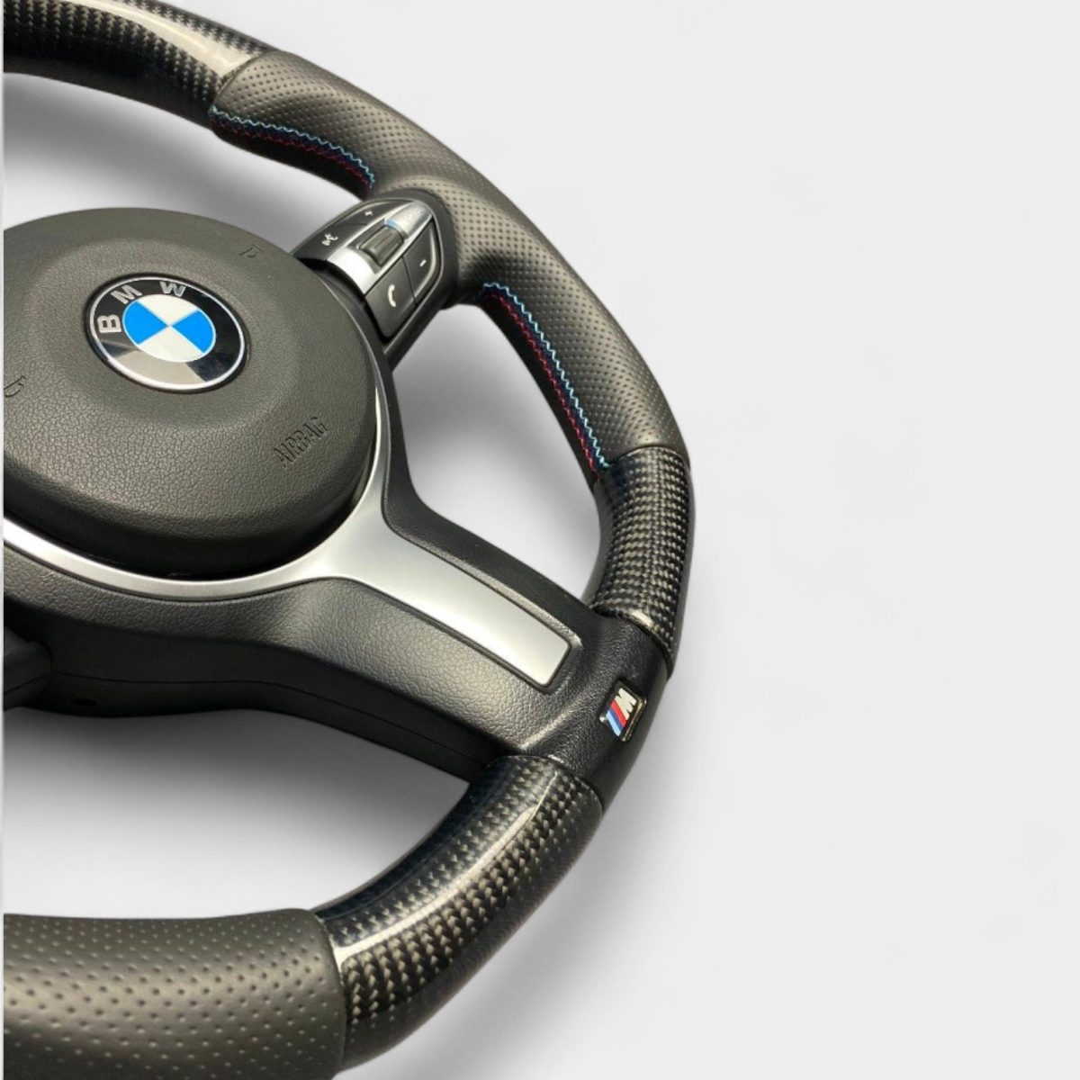 BMW F30 flat bottom carbon wheel close up