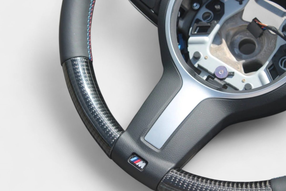 BMW F35 flat bottom carbon steering wheel close-up