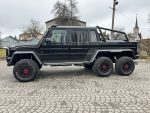 Mercedes-Benz G63 AMG 6×6 side profile view in white, showcasing six-wheel off-road design