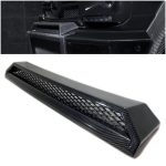 Close-up of AMG front bumper upper trim made from carbon fiber with glossy finish.