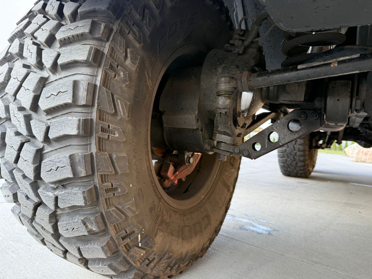 Detailed shot of aggressive tread design on 37-inch off-road tire with Kubay Design rim.