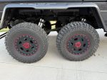 Side view of dual 37-inch off-road tires mounted on Mercedes-Benz W463 6×6.