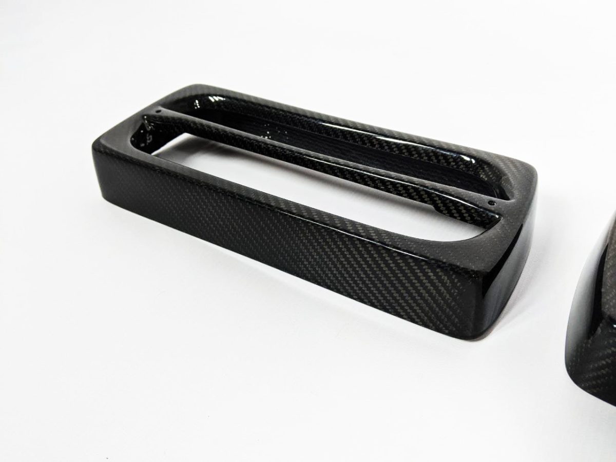 Angled view of carbon fiber tail light frame covers for Mercedes-Benz W463 / 4×4.