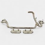 Overview layout of uninstalled stainless steel exhaust system piping with mandrel bends and mounting hangers