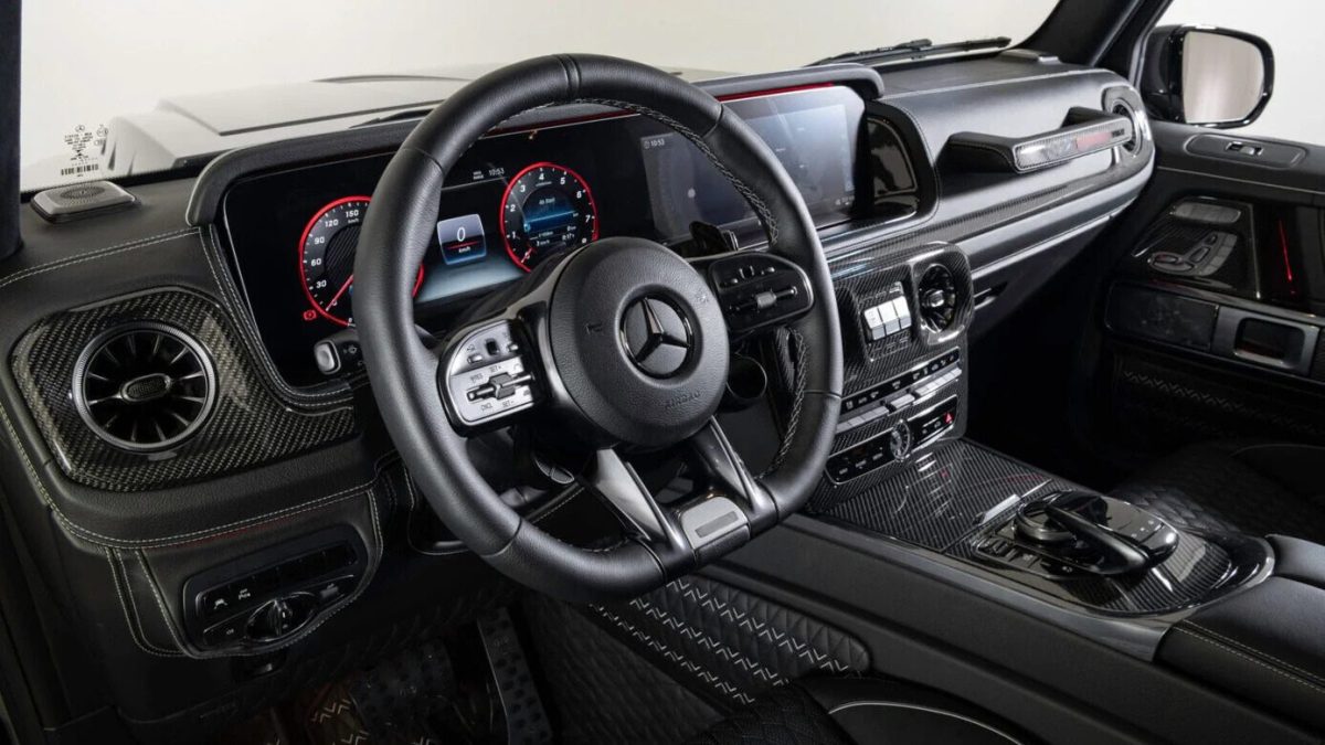 Mercedes-Benz G-Class W463A carbon fiber dashboard and console trim – glossy OEM-style finish.