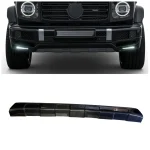 Head-on perspective showing dark SUV front fascia equipped with glossy composite diffuser overlay and illuminated light bars
