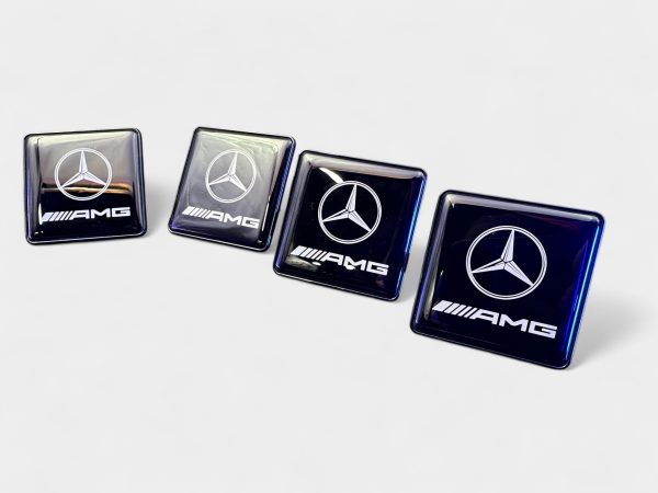 array of four gloss black square interior badges
