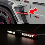 Close-up shot showing carbon arch insert with active red rocket emblem mounted above Biturbo badge