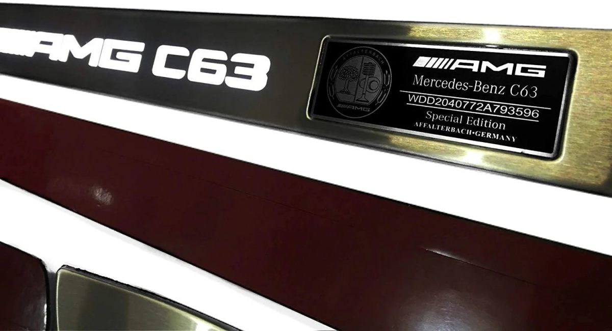 Polished stainless door sill with white illumination – close-up