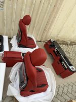 Luxury red and black leather interior conversion for Mercedes-Benz G-Class W463 with complete OEM-style components.