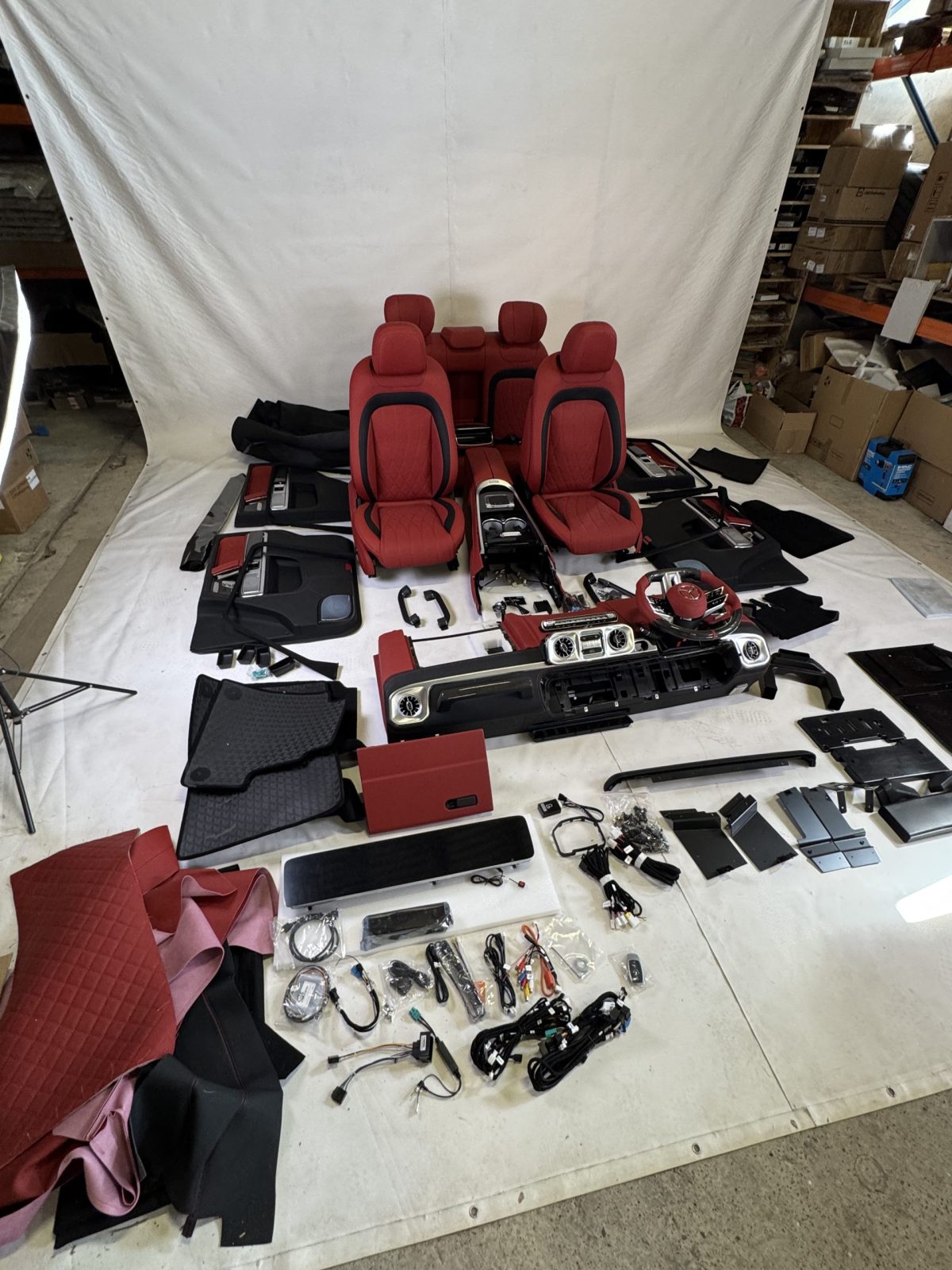 Complete W465 Style interior conversion package for Mercedes-Benz G-Class W463 with dashboard, seats, wiring, and trim.