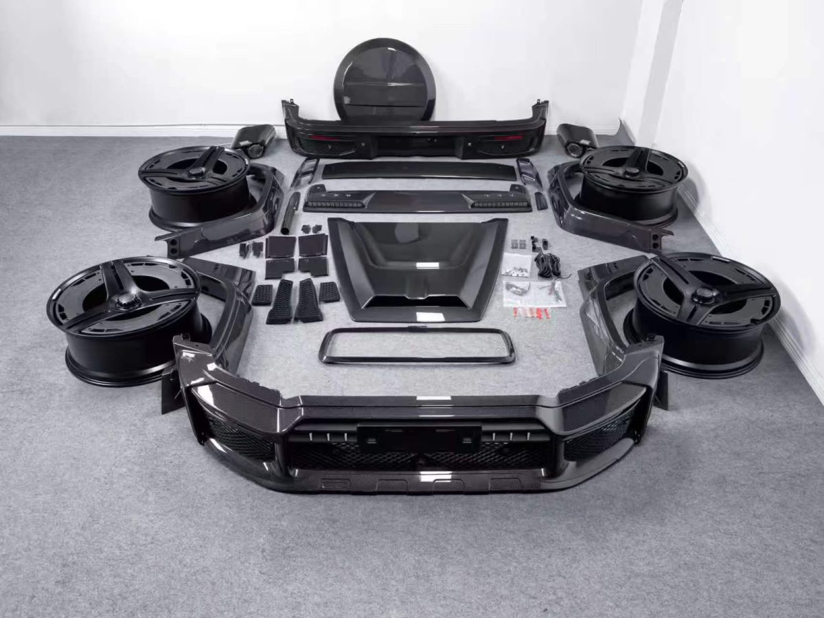 Rocket Style carbon fiber widebody kit for Mercedes-Benz G-Class W465 laid out on the floor
