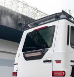 Integrated LED entrance mood lighting within carbon fiber fender flares for G-Class W465