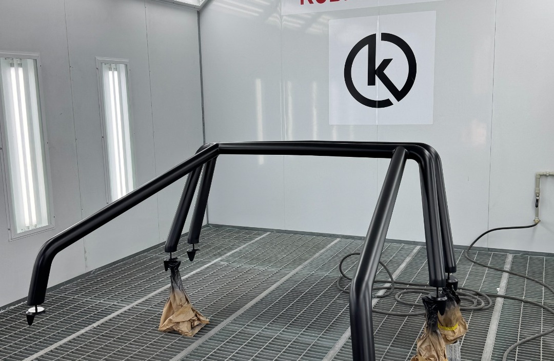 Roll cage and rear bed rails for the 2022 Mercedes G-Class 6x6 hanging during painting at Kubay Design