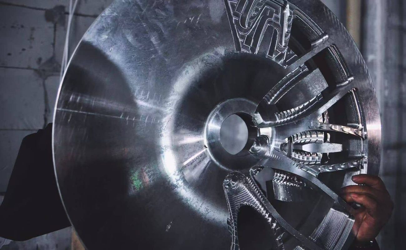 Forged wheel manufacturing facility with finished custom rims